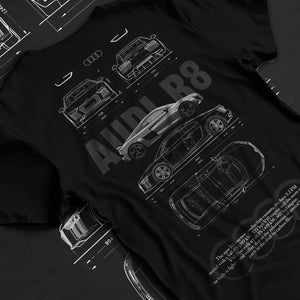 Black T-shirt laid flat with natural fabric folds, featuring Audi R8 v10 racing german street performance motorsport graphic.