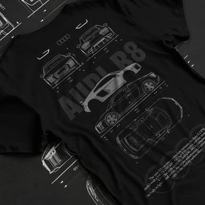 Black T-shirt laid flat with natural fabric folds, featuring Audi R8 v10 euro enthusiast racing street performance graphic.