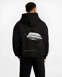 Black hoodie worn by a male model, back view, featuring Audi R8 turbo v10 racing german street performance graphic.