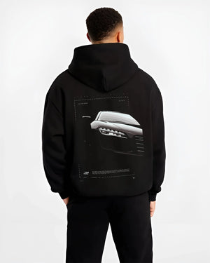 Black hoodie worn by a male model, back view, featuring Audi R8 turbo v10 racing german street performance graphic.