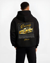 Black hoodie worn by a male model, back view, featuring SKYLINE racing drift japanese street legend speed enthusiast graphic.