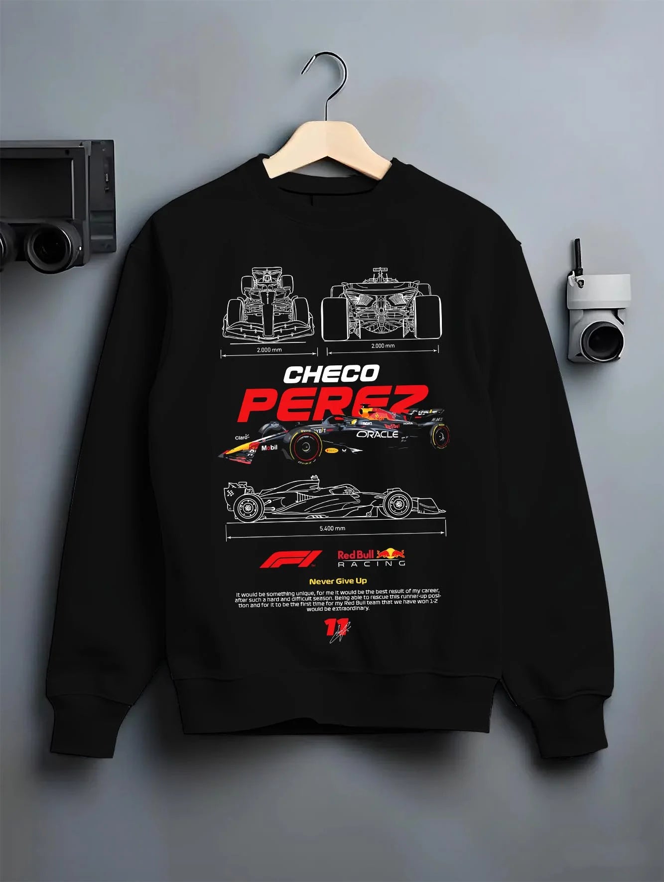 Black crewneck sweatshirt on a hanger against a grey wall, featuring rs racing drift motorsport japanese street performance graphic.