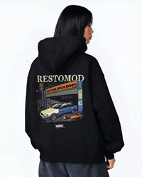 Black hoodie worn by a female model, back view, featuring Toyota AE86 drift jdm tuner street racing performance graphic.