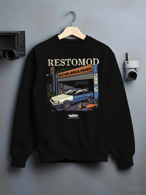 Black crewneck sweatshirt on a hanger against a grey wall, featuring Toyota AE86 drift jdm tuner street racing performance graphic.