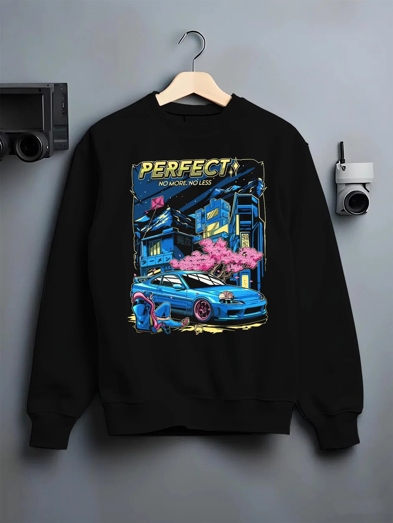 Black crewneck sweatshirt on a hanger against a grey wall, featuring Nissan SILVIA turbo racing drift jdm japanese tuner graphic.