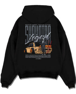 Black pullover hoodie laid flat on a white background, featuring Toyota jdm stance legend racing street performance graphic.