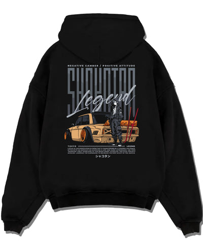 Black pullover hoodie laid flat on a white background, featuring Toyota jdm stance legend racing street performance graphic.