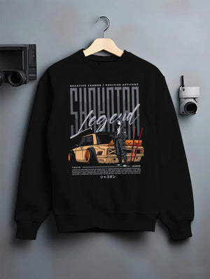 Black crewneck sweatshirt on a hanger against a grey wall, featuring Toyota jdm stance legend racing street performance graphic.