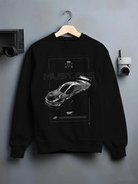 Black crewneck sweatshirt on a hanger against a grey wall, featuring shelby turbo turbocharged racing american muscle graphic.