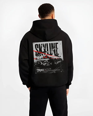 Black hoodie worn by a male model, back view, featuring Nissan Skyline R34 r34 skyline turbo turbocharged racing jdm street graphic.