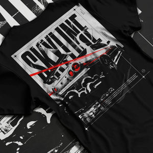 Black T-shirt laid flat with natural fabric folds, featuring Nissan Skyline R34 r34 skyline turbo turbocharged racing jdm graphic.