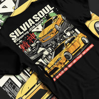 Black T-shirt laid flat with natural fabric folds, featuring Nissan Silvia S15 silvia drift jdm japanese street racing graphic.