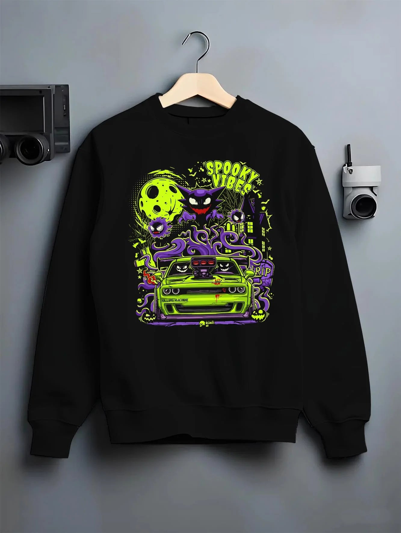 Black crewneck sweatshirt on a hanger against a grey wall, featuring jdm street racing performance motorsport automotive graphic.