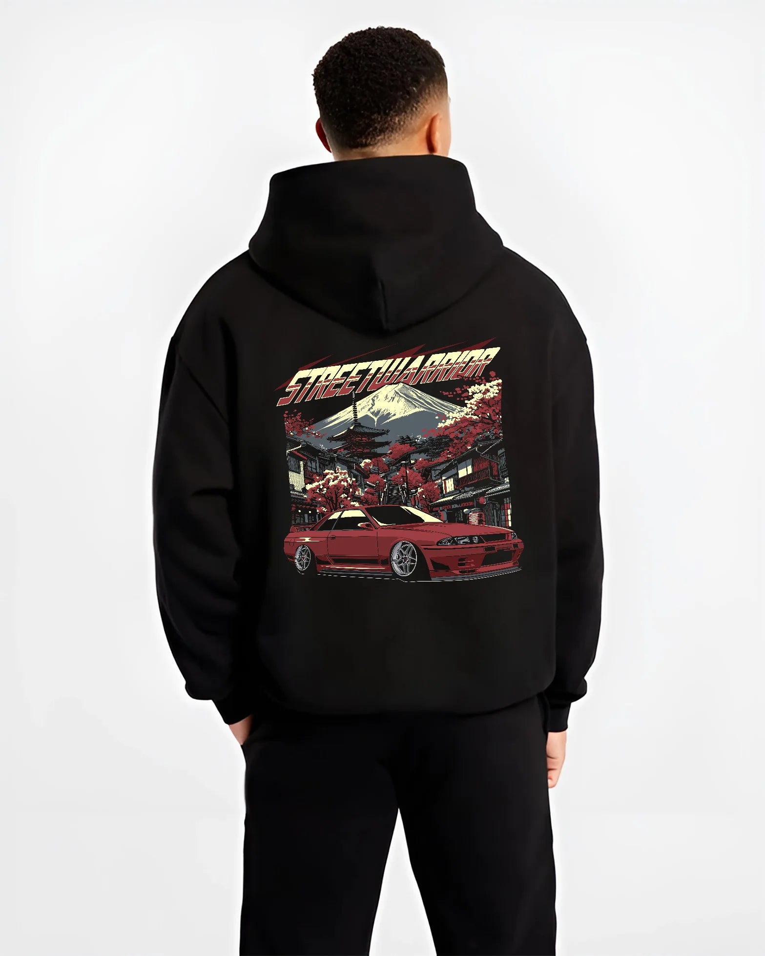 Black hoodie worn by a male model, back view, featuring SKYLINE r32 drift jdm street retro racing performance graphic.