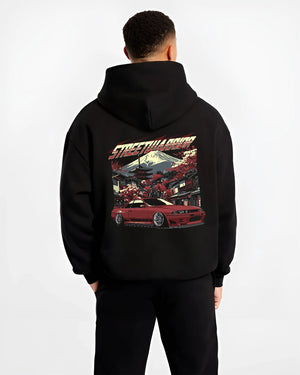 Black hoodie worn by a male model, back view, featuring SKYLINE r32 drift jdm street retro racing performance graphic.