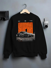 Black crewneck sweatshirt on a hanger against a grey wall, featuring Toyota Supra turbo racing drift jdm japanese tuner supjdm.