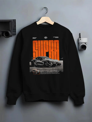 Black crewneck sweatshirt on a hanger against a grey wall, featuring Toyota Supra turbo racing drift jdm japanese tuner supjdm.