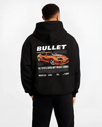 Black hoodie worn by a male model, back view, featuring Toyota Supra MK4 supra racing drift jdm tuner street legend graphic.