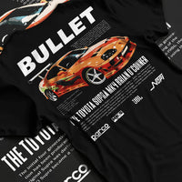 Black T-shirt laid flat with natural fabric folds, featuring Toyota Supra MK4 supra racing drift jdm tuner street legend graphic.