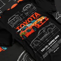 Black T-shirt laid flat with natural fabric folds, featuring Toyota Supra MK4 supra turbo turbocharged racing drift jdm graphic.