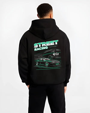 Black hoodie worn by a male model, back view, featuring Toyota Supra turbo jdm street racing performance motorsport graphic.