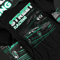 Black T-shirt laid flat with natural fabric folds, featuring Toyota Supra turbo jdm street racing performance motorsport graphic.