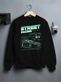 Black crewneck sweatshirt on a hanger against a grey wall, featuring Toyota Supra turbo jdm street racing performance graphic.