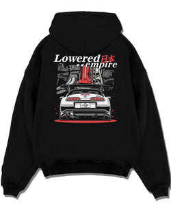 Black pullover hoodie laid flat on a white background, featuring Toyota Supra turbo drift jdm lowered power racing graphic.