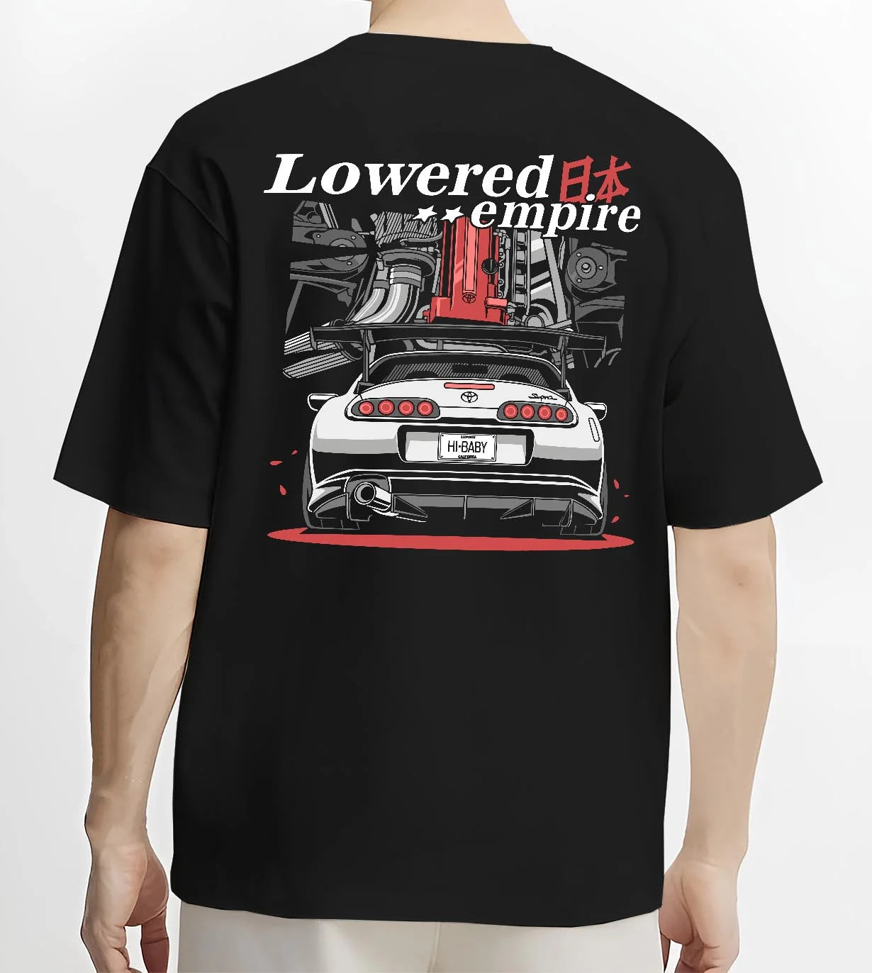 Black T-shirt worn by a male model, back view, featuring Toyota Supra turbo drift jdm lowered power racing graphic.