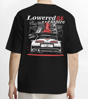 Black T-shirt worn by a male model, back view, featuring Toyota Supra turbo drift jdm lowered power racing graphic.