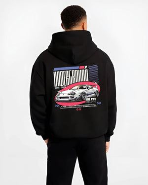 Black hoodie worn by a male model, back view, featuring Toyota Supra drift tokyo underground tokyo drift racing street graphic.