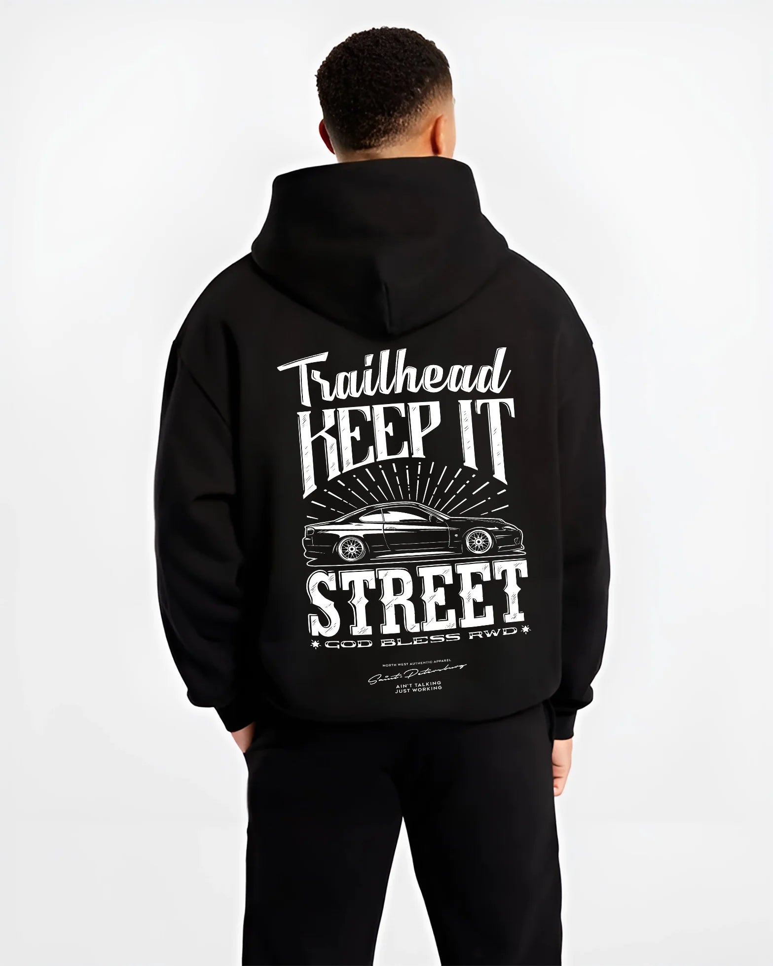 Black hoodie worn by a male model, back view, featuring rs racing race street enthusiast performance motorsport automotive graphic.