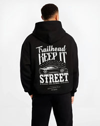 Black hoodie worn by a male model, back view, featuring rs racing race street enthusiast performance motorsport automotive graphic.