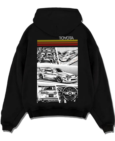 Black pullover hoodie laid flat on a white background, featuring Toyota Supra rs racing jdm tuner street vintage enthusiast graphic.