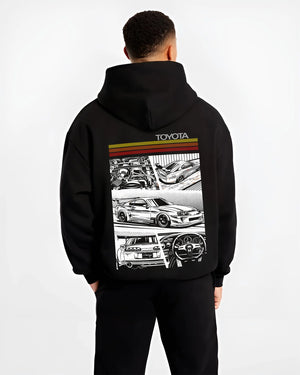 Black hoodie worn by a male model, back view, featuring Toyota Supra rs racing jdm tuner street vintage enthusiast graphic.