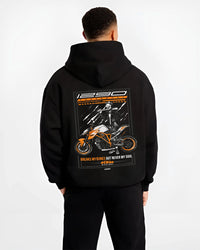 Black hoodie worn by a male model, back view, featuring KTM racing street beast performance motorsport automotive graphic.