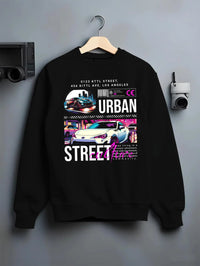 Black crewneck sweatshirt on a hanger against a grey wall, featuring racing japanese street retro performance motorsport graphic.