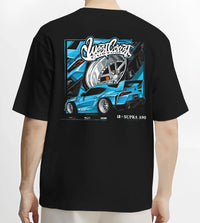 Black T-shirt worn by a male model, back view, featuring Toyota Supra racing jdm tuning street enthusiast performance graphic.