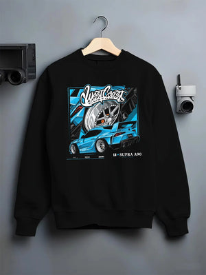 Black crewneck sweatshirt on a hanger against a grey wall, featuring Toyota Supra racing jdm tuning street enthusiast graphic.