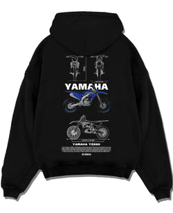 Black pullover hoodie laid flat on a white background, featuring Yamaha YZ250 racing street enthusiast performance graphic.
